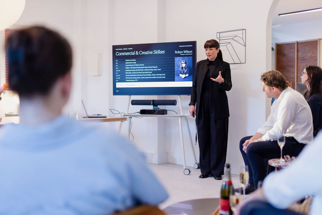 Robyn Wilson presenting her commercial and creative skillset to a small group
